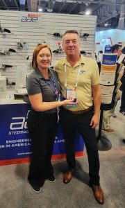 CRP Automotive’s Nicole Ryan (left), presents Steve Dresser (right) of Hirsig-Frazier Company with the 2022 Sales Representative of the Year award.